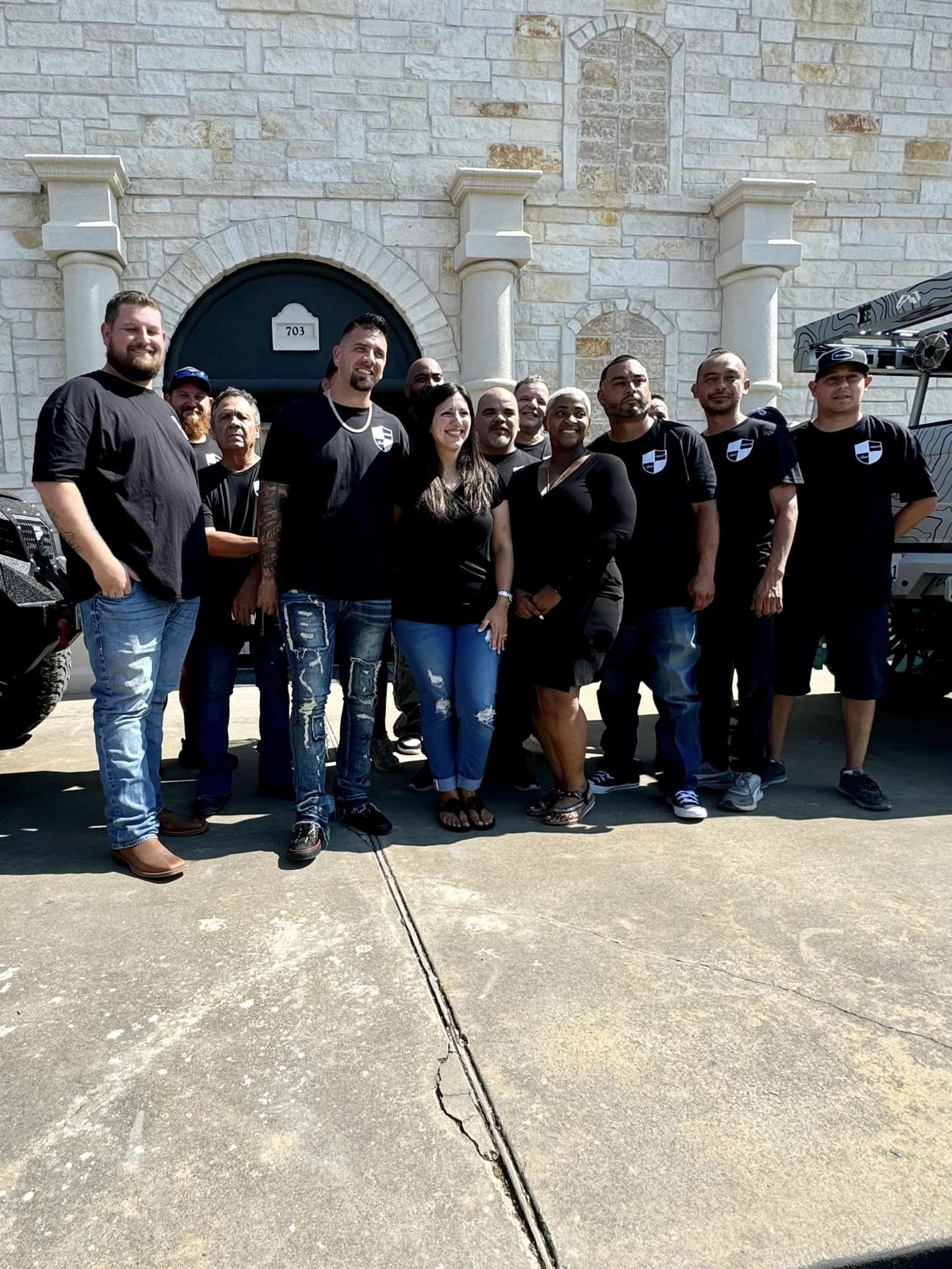The Alamo Collision team outside their shop in Alvin, TX